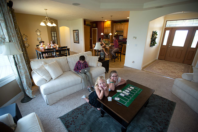 family in new home living room